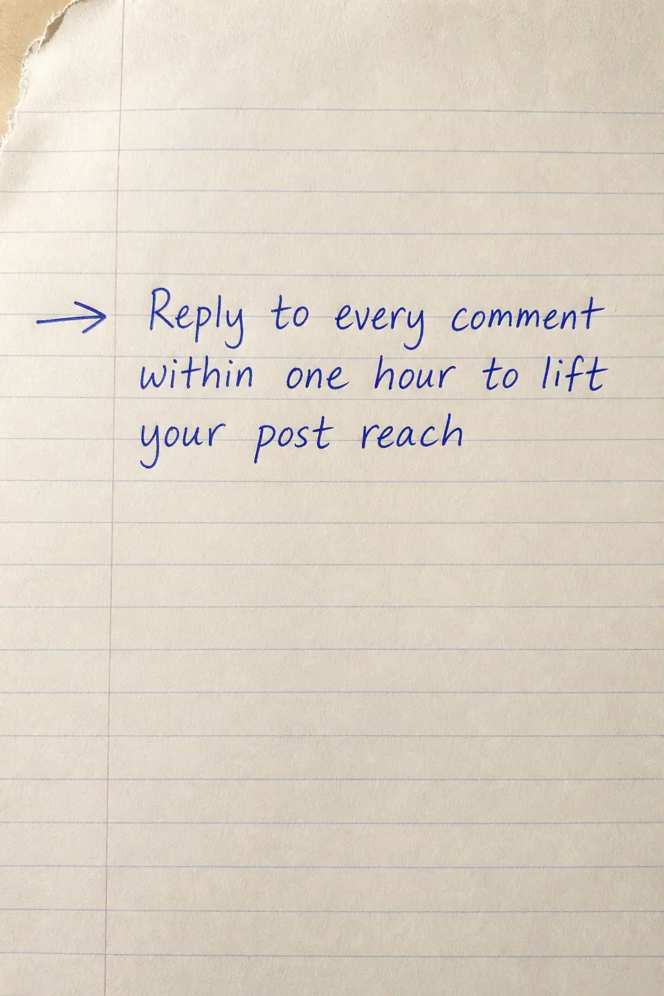 Handwritten tip card on lined paper reading: Reply to every comment within one hour to lift your post reach