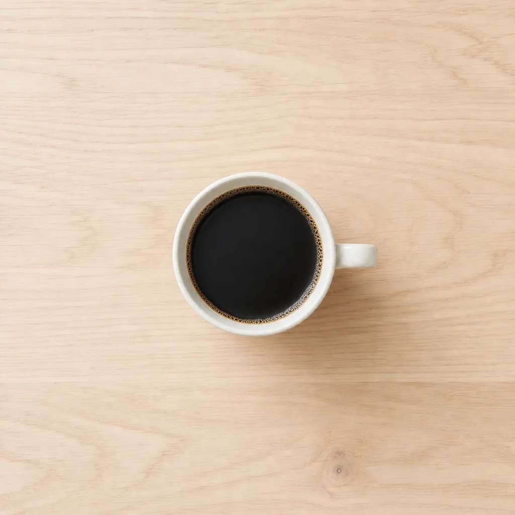 GPT Image 2 composition example: a top-down flat-lay of a coffee cup with negative space